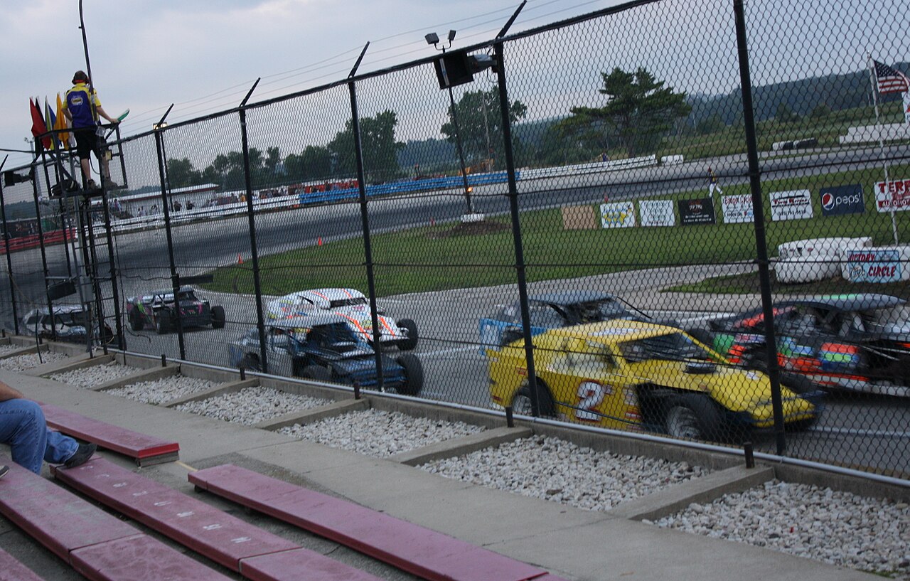 141 Speedway — IMCA Sport Modifieds on the asphalt at 141 Speedway