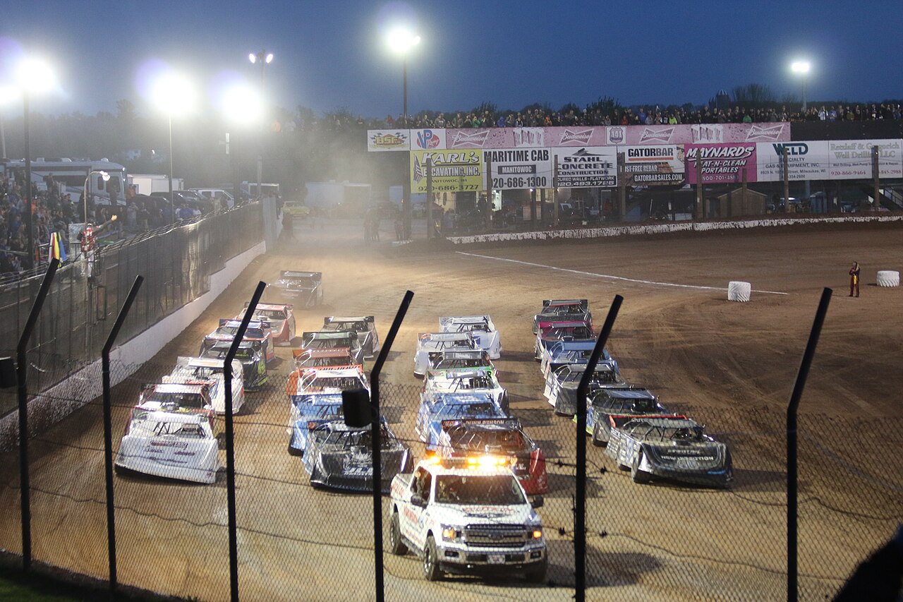 141 Speedway — Lucas Oil Late Model Dirt Series drivers salute the fans by going 4 wide before the start of the race at 141 Speedway.