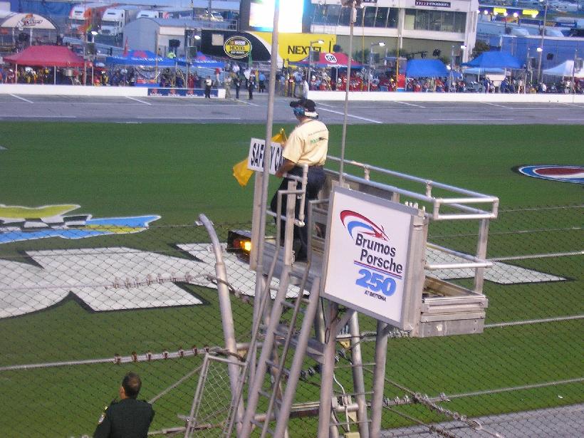 Daytona International Speedway — Caution flags fly at Daytona International Speedway as the Brumos Porsche 250 is underway.